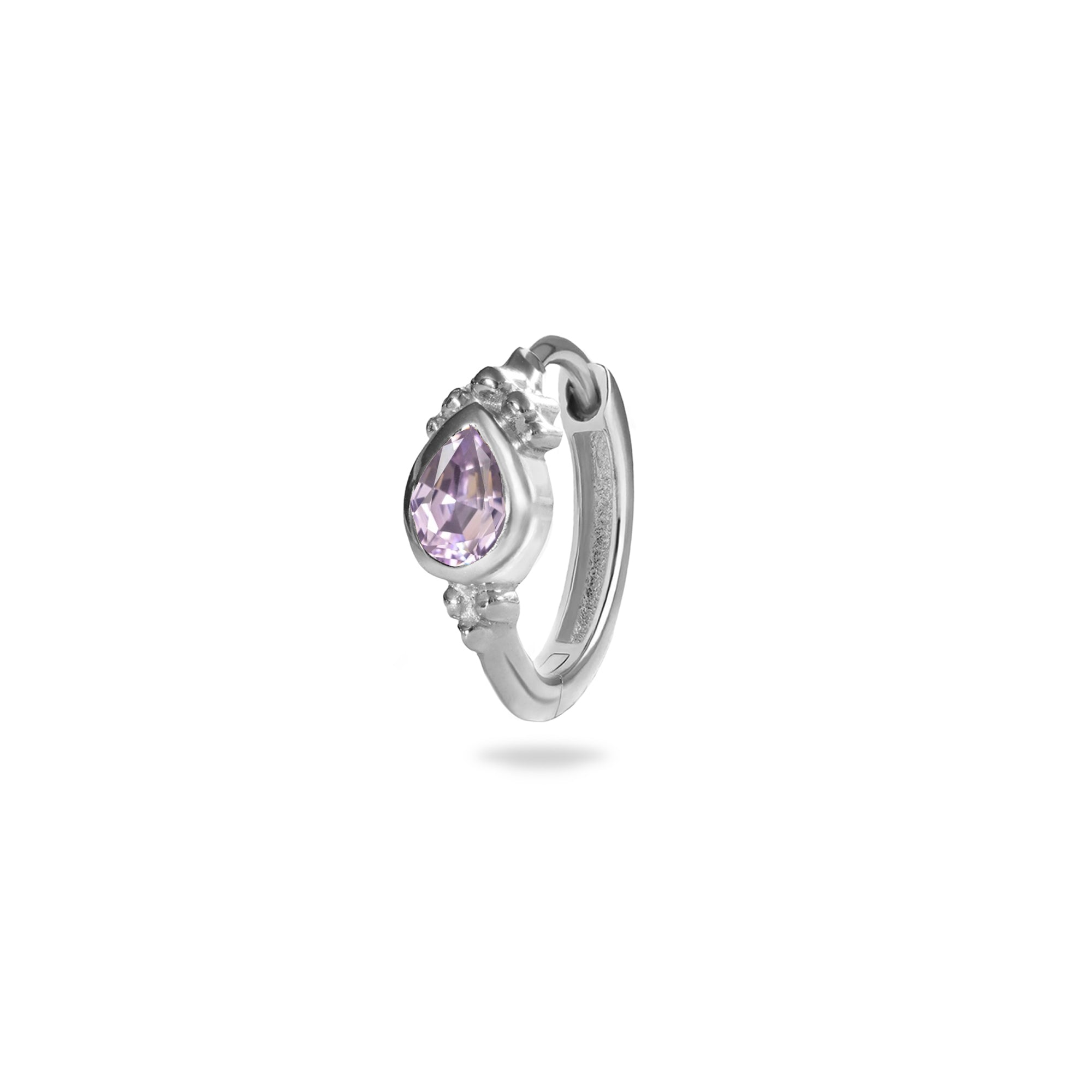 Silver huggie with a purple gemstone on a white background