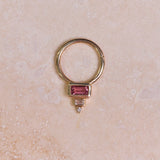 Pink Tourmaline, Diamond & Topaz Daith Hoop 9k Gold on marble surface