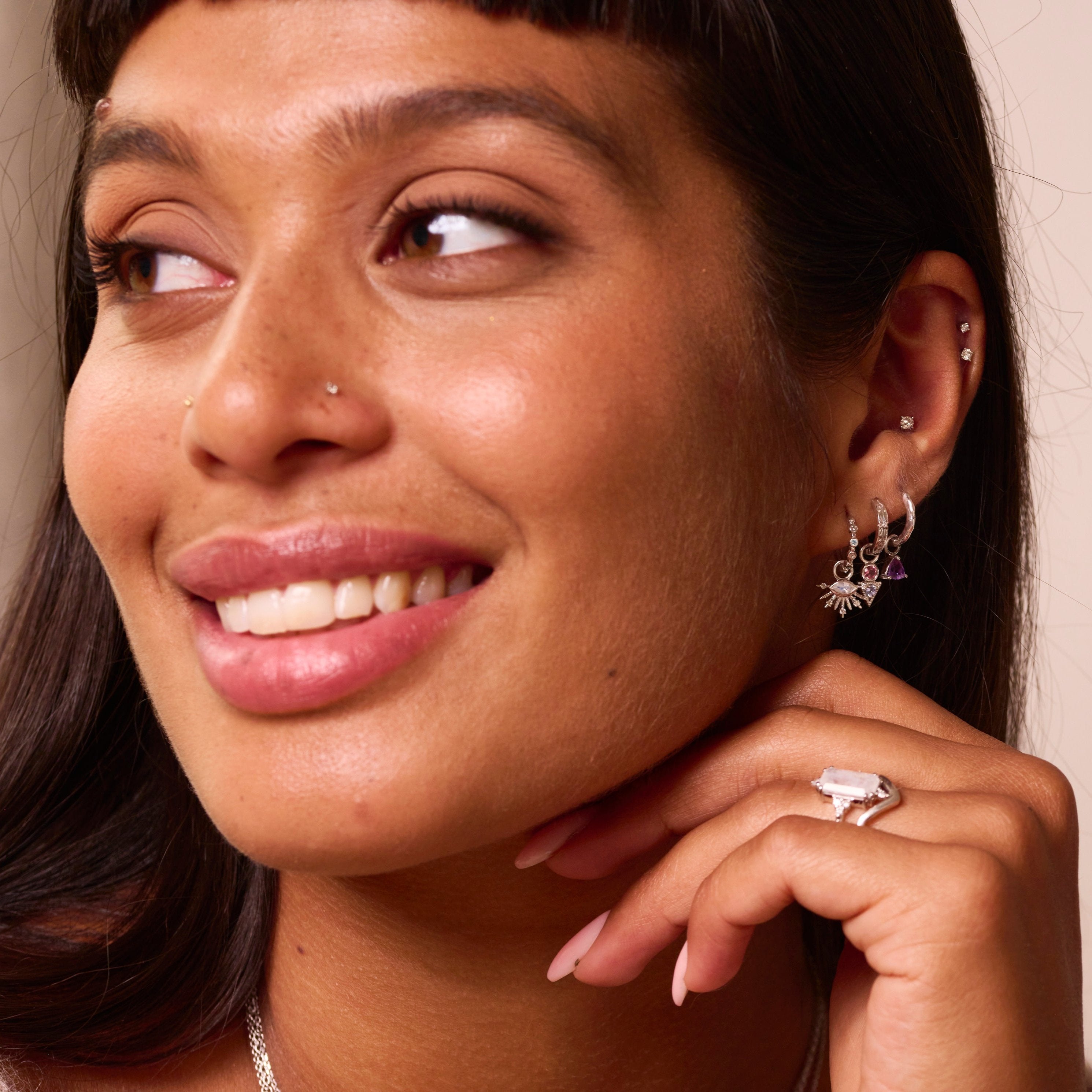 model wearing sterling silver jewellery including the Pink Tourmaline & Tanzanite Geo Earring Charm Sterling Silver