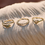 Raindrop Ring 9k Gold displayed with the snake ring and scattered diamond band ring