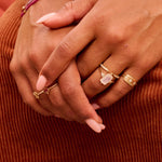 model hands showing solid gold rings including the Rectangle Moonstone & Diamond Ring 9k Gold 