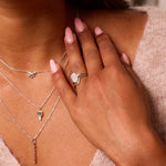 model wearing sterling silver jewellery including the Rectangle Moonstone & White Sapphire Ring Sterling Silver