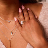 model wearing sterling silver jewellery including the Rectangle Moonstone & White Sapphire Ring Sterling Silver