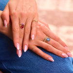 model hands showing ring stacks in solid gold including the Rhodolite Garnet, Moonstone & White Sapphire Ring 9k Gold
