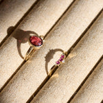 Garnet gold rings in tray