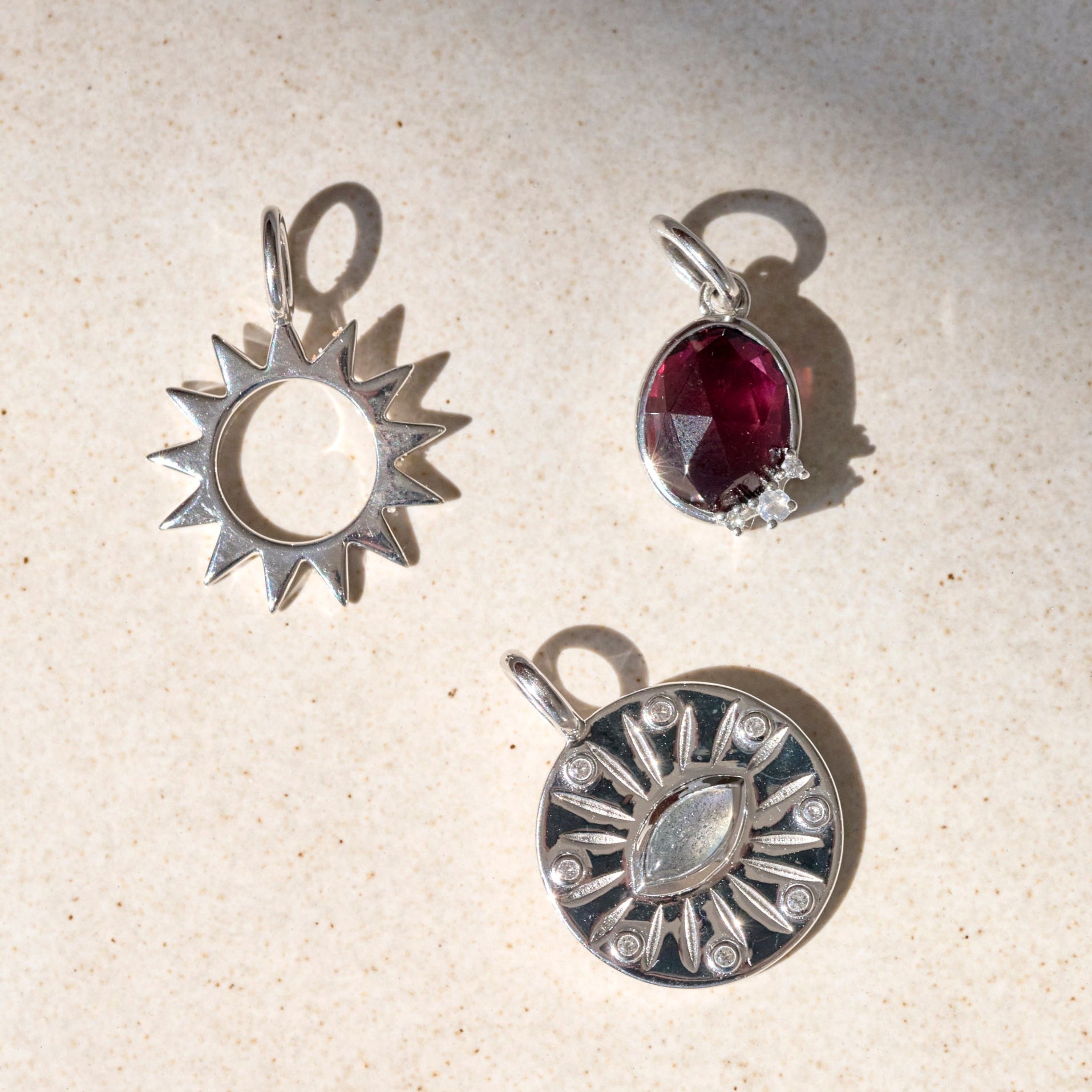 silver stone pendants on limestone