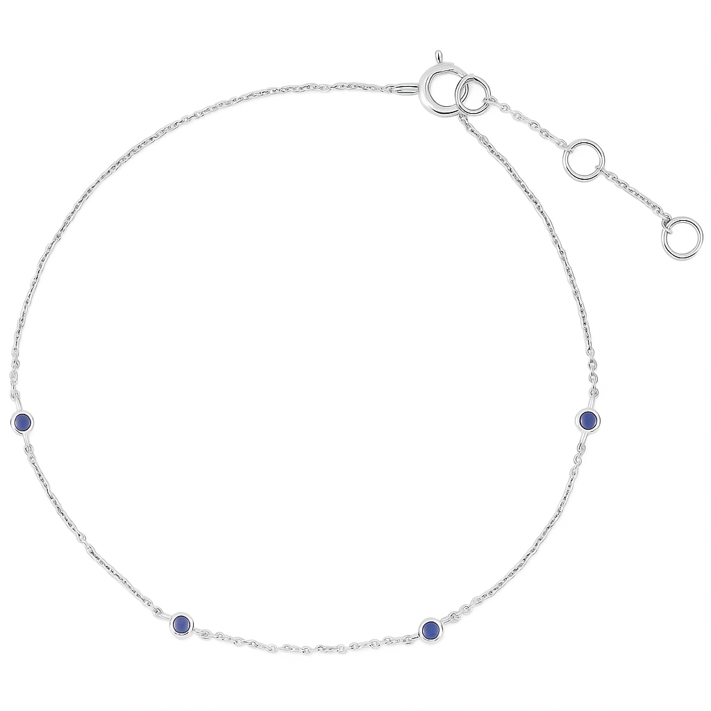 Silver bracelet with blue gemstones on a white background