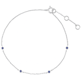 Silver bracelet with blue gemstones on a white background