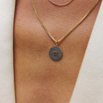 Sapphire & Ruby 9k gold pendant on model