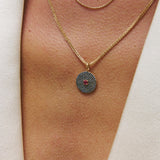 Sapphire & Ruby 9k gold pendant on model