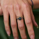 stacked gold rings on models hand