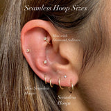 Close-up of an ear wearing various hoop earrings with text indicating hoop sizes.