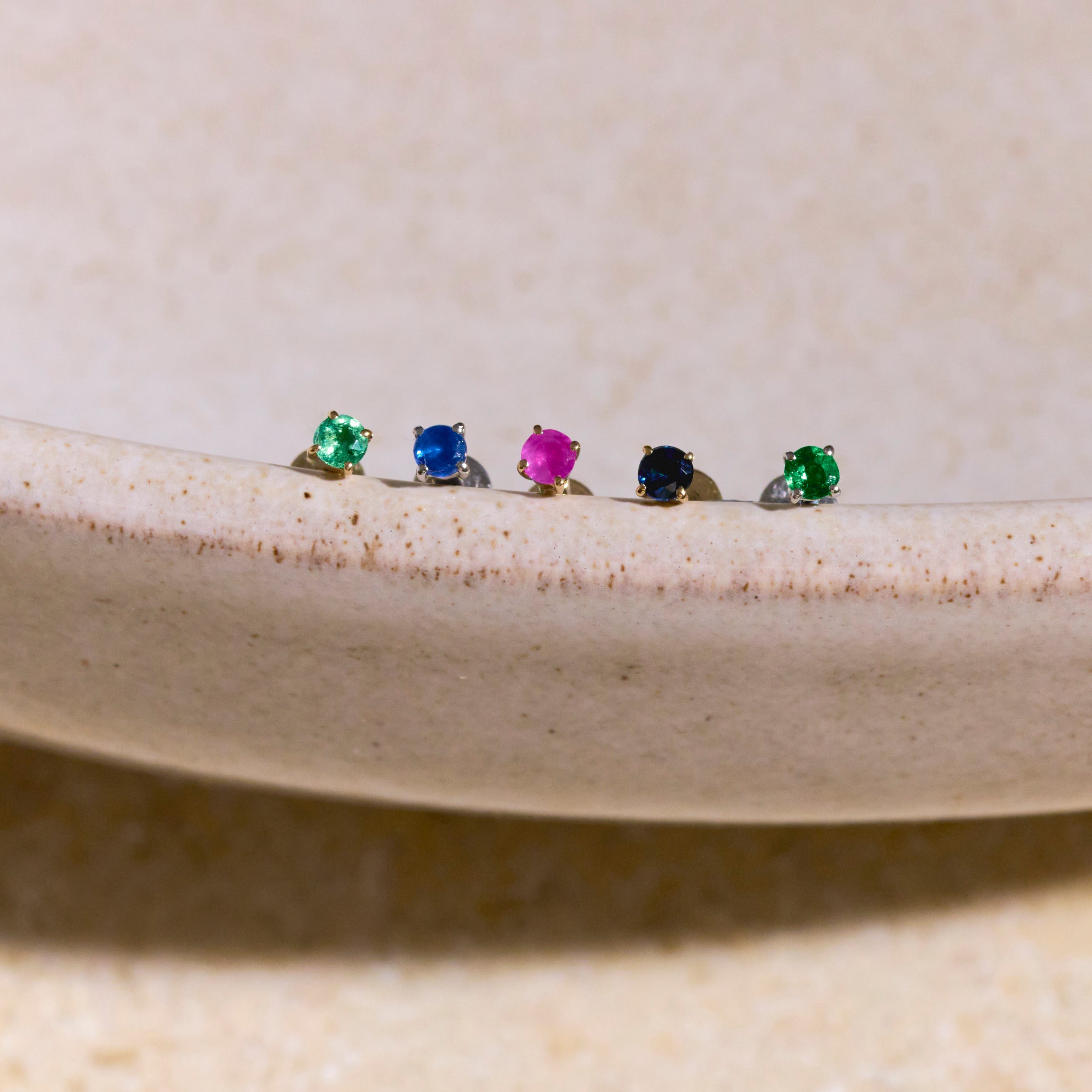 flat back earring layed on bowl
