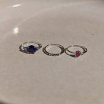 three rings on stone surface