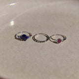 three rings on stone surface