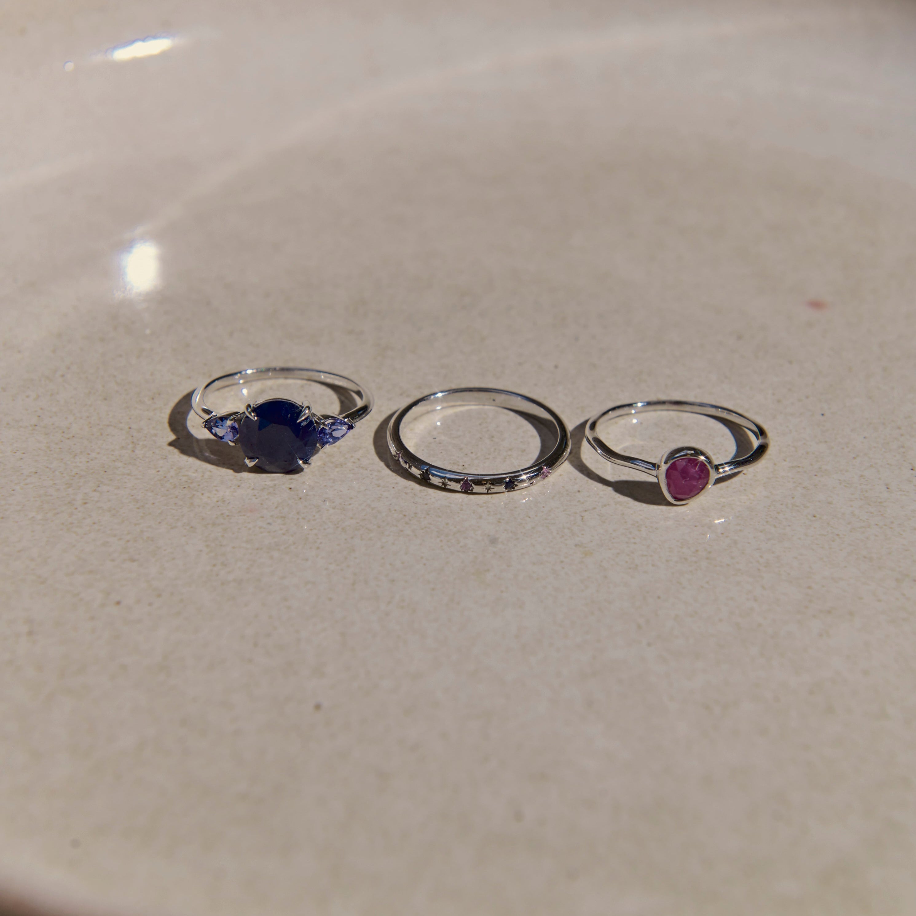 three rings on stone surface
