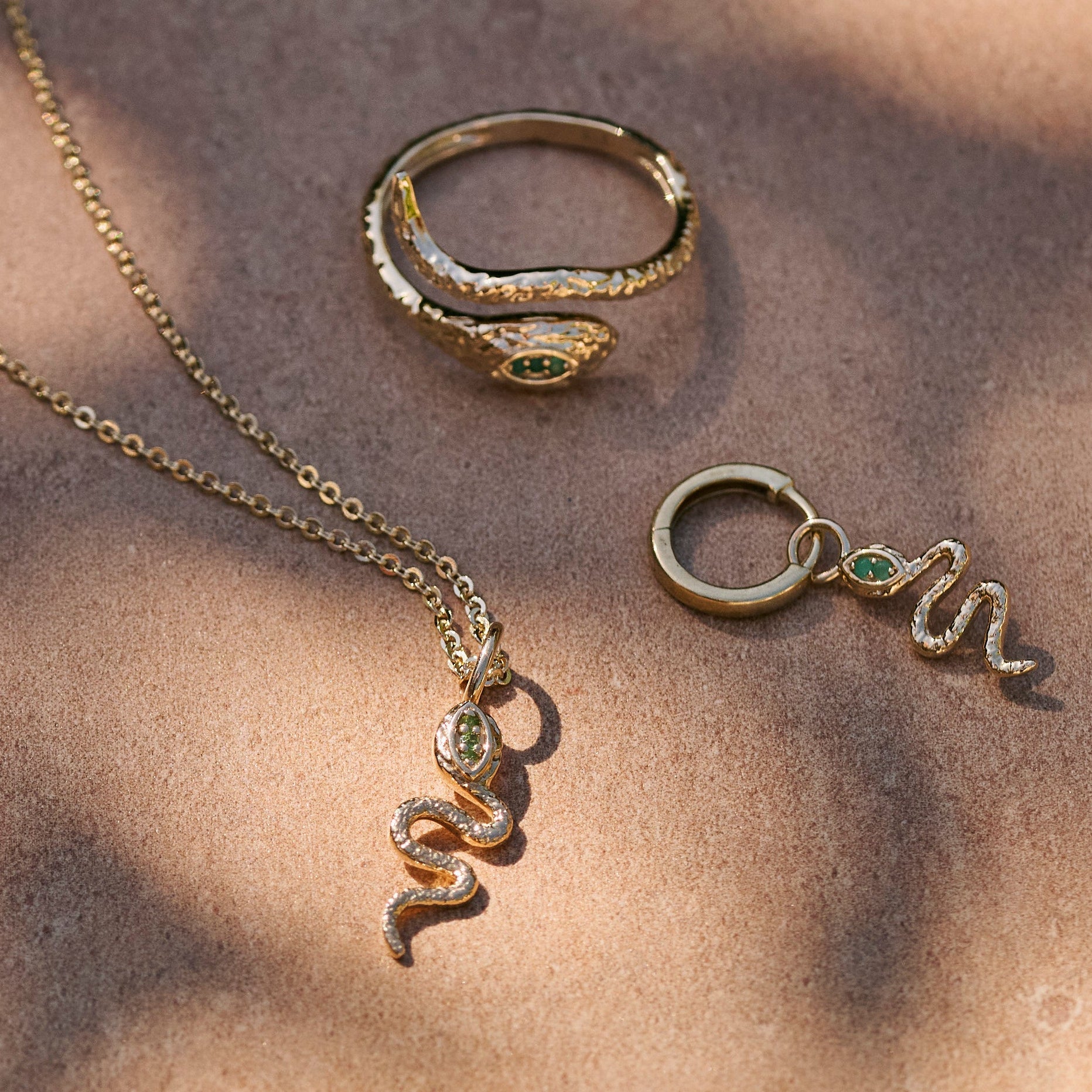 Snake Pendant 9k Gold displayed with matching snake ring and snake hoop earring
