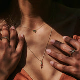 model wearing the Snake Pendant 9k Gold and matching ring