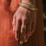 model wearing the Snake Ring 9k Gold and solid gold bracelets