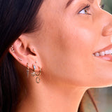 model wearing solid gold jewellery including the 