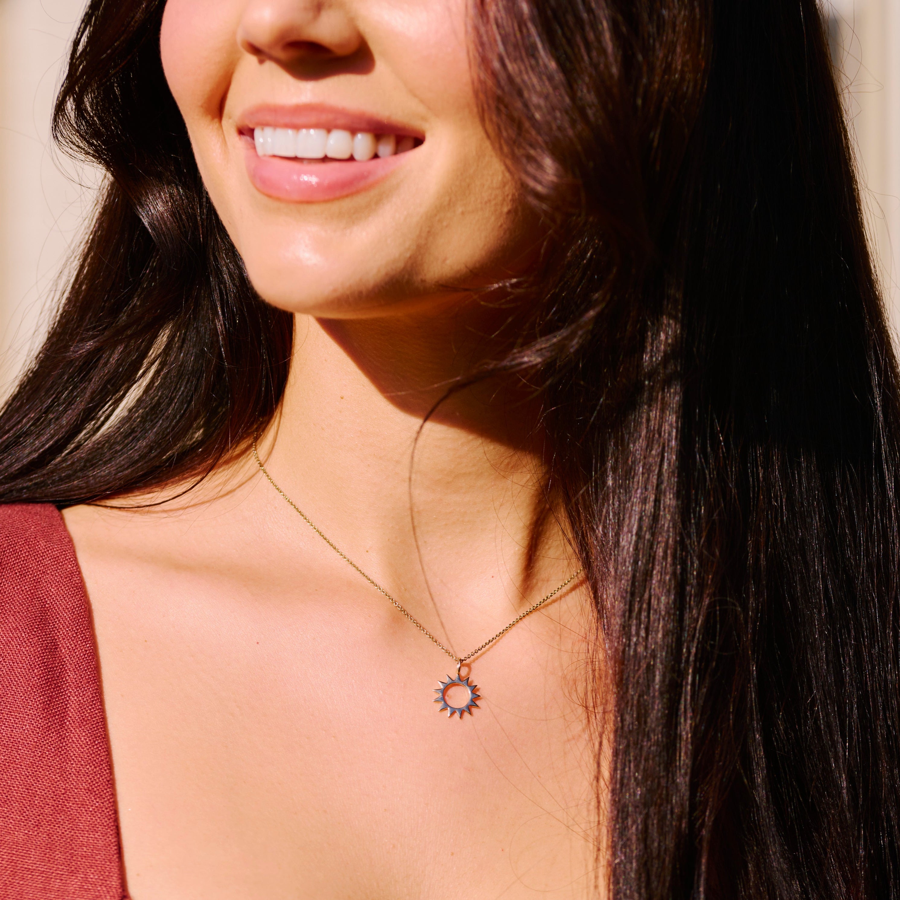 model wearing the Sunburst Silhouette Necklace 9k Gold
