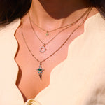 close up of solid gold necklaces including the Sunburst Silhouette Necklace 9k Gold