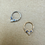 close up of the Tanzanite & Diamond Daith Hoop Earring 9k White Gold and Tanzanite & Diamond Daith Hoop Earring 9k White Gold
