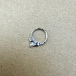 Tanzanite & Diamond Daith Hoop Earring 9k White Gold on hard surface