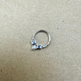 Tanzanite & Diamond Daith Hoop Earring 9k White Gold on hard surface