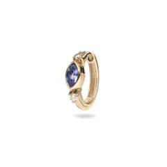 Gold hoop earring with a blue gemstone and clear stone on a white background