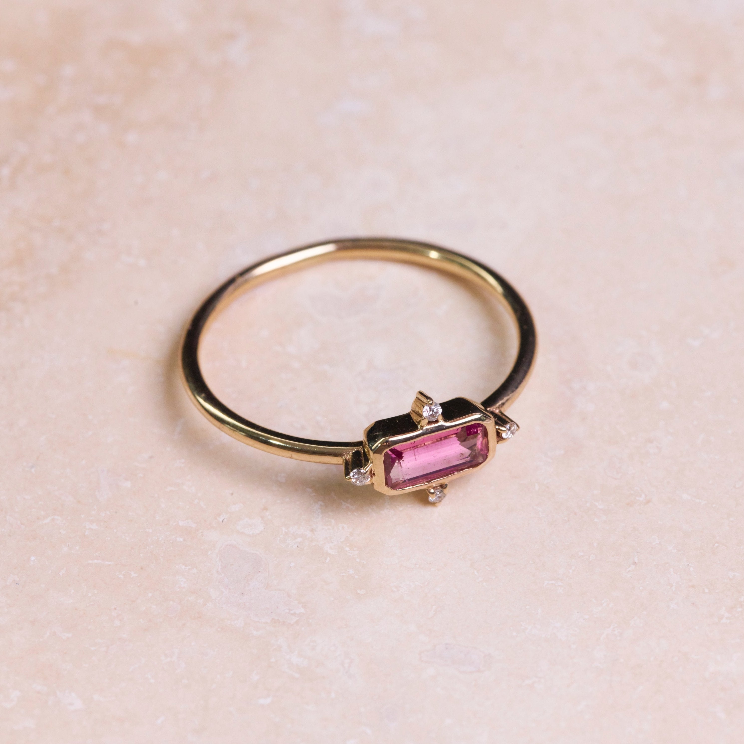 Pink Tourmaline & Diamond Ring 9k Gold on hard surface