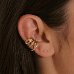 close up of 14k gold vermeil ear cuffs stacked including the Topaz Crossover Ear Cuff 14k Gold Vermeil