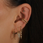 model wearing ear cuffs including the Topaz Scattered Ear Cuff in 14 k Gold Vermeil
