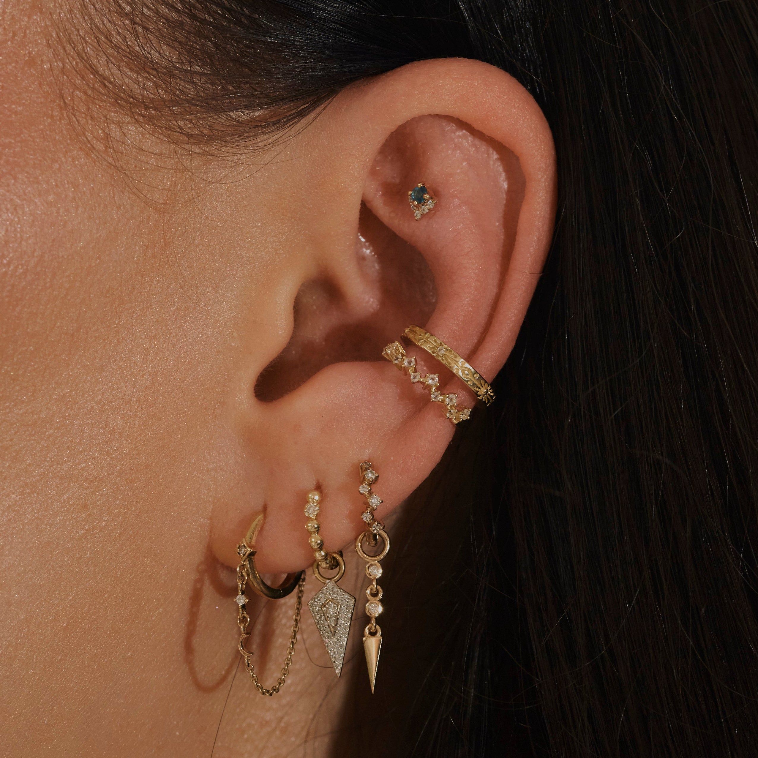 model wearing ear cuffs including the Topaz Scattered Ear Cuff in 14 k Gold Vermeil
