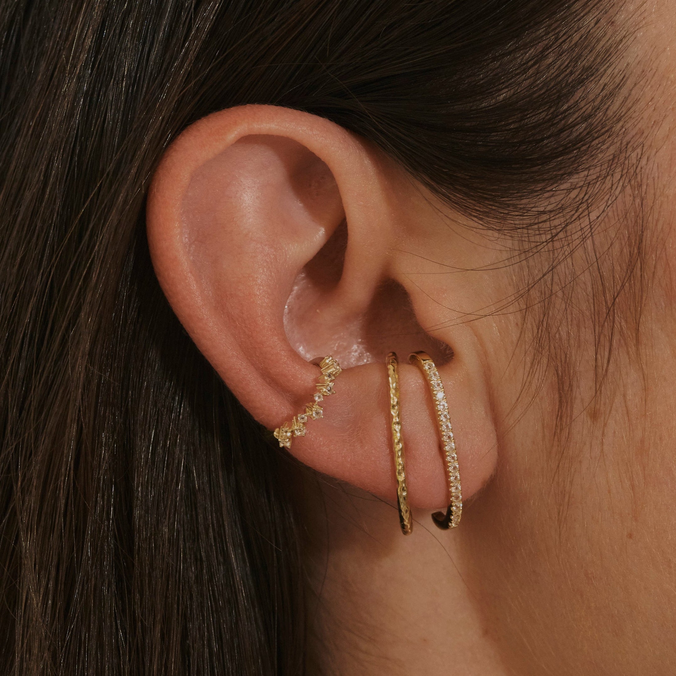 close up of ear model wearing suspender earrings in 14k gold vermeil and the Topaz Scattered Ear Cuff 14k Gold Vermeil