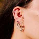 Silver earrings on model