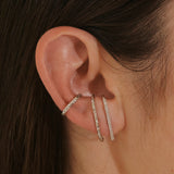model wearing silver suspender earrings and the White Sapphire Celestial Ear Cuff 14k Sterling Silver
