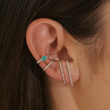 close up of ear stack in silver including the White Sapphire Celestial Ear Cuff Sterling Silver