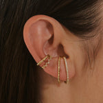 close up of ear model wearing the White Sapphire Pave Suspender Earring 14k Gold Vermeil other ear cuffs