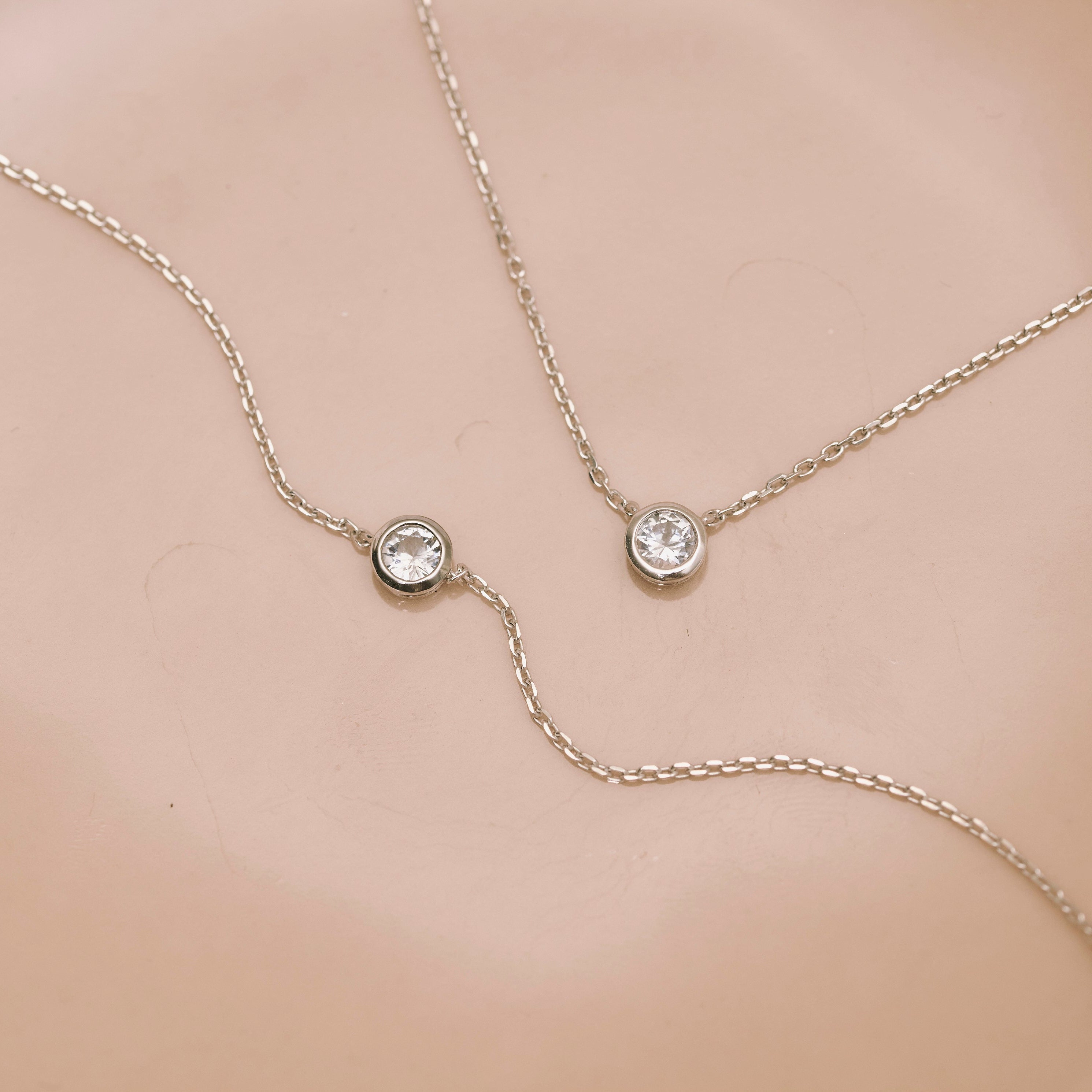 White Sapphire Solitaire Bracelet Sterling Silver displayed with the matching necklace