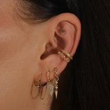 model ear stack including the White Sapphire Starburst Ear Cuff 14k Gold Vermeil and topaz scattered ear cuff