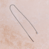 diamond white gold earring threader on stone background