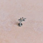 White gold earring on stone