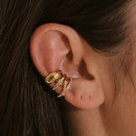 close up of model ear stacking 14k gold vermeil ear cuffs including the Wide Hammered Ear Cuff 14k Gold Vermeil