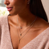 model wearing silver necklaces including the Moonstone & White Sapphire Sunburst Necklace Sterling Silver