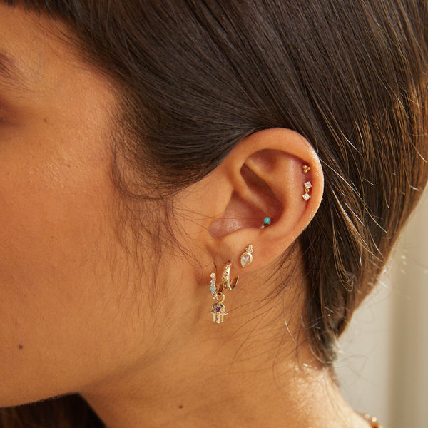 gold earring stack including the Amazonite, Tanzanite & Moonstone Huggie Hoop Earring 9k Gold