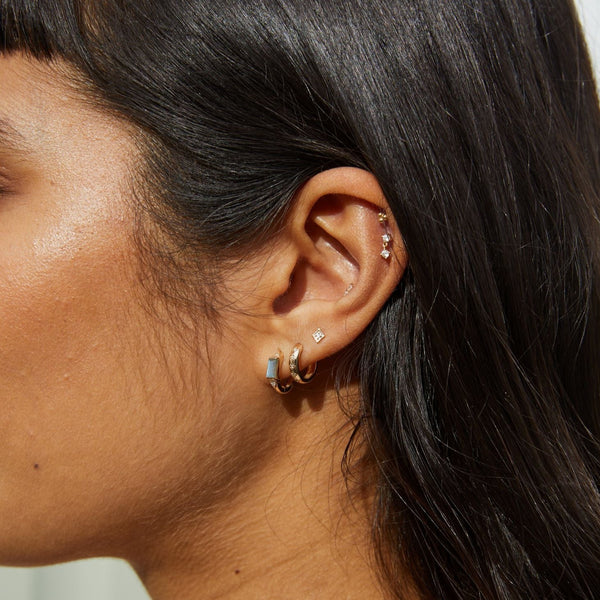 model wearing ear stack with Diamond Star Stud Earring 9k Gold on upper lobe