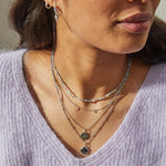 model wearing silver necklaces including beaded necklaces and the Multi Semi-Precious Organic Coin Pendant Sterling Silver