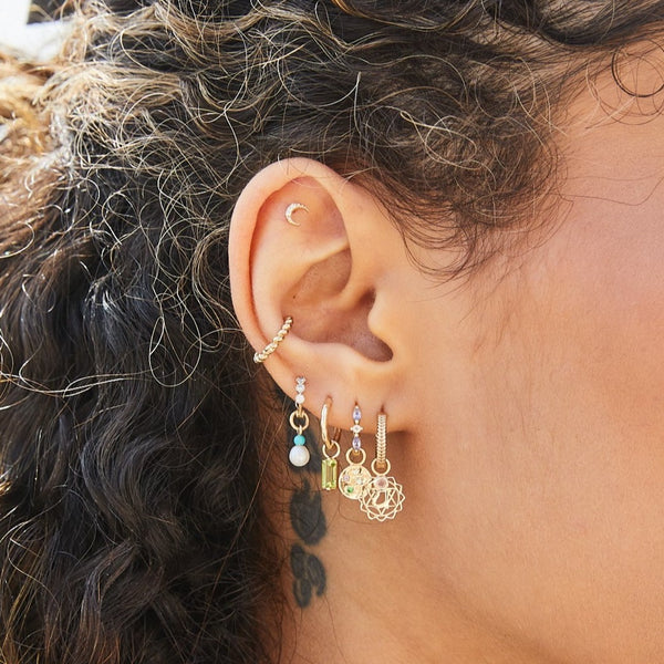 solid gold ear stack including the Peridot Baguette Earring Charm 9k Gold