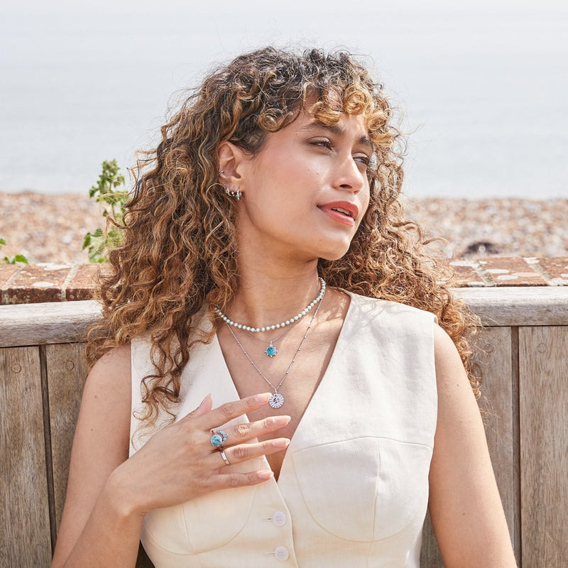 model wearing sterling silver jewellery pieces including the Copper Turquoise & Orange Carnelian Ring Sterling Silver